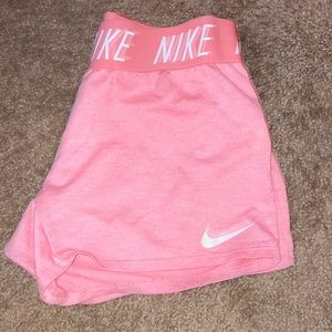 Pink Nike athletic shorts